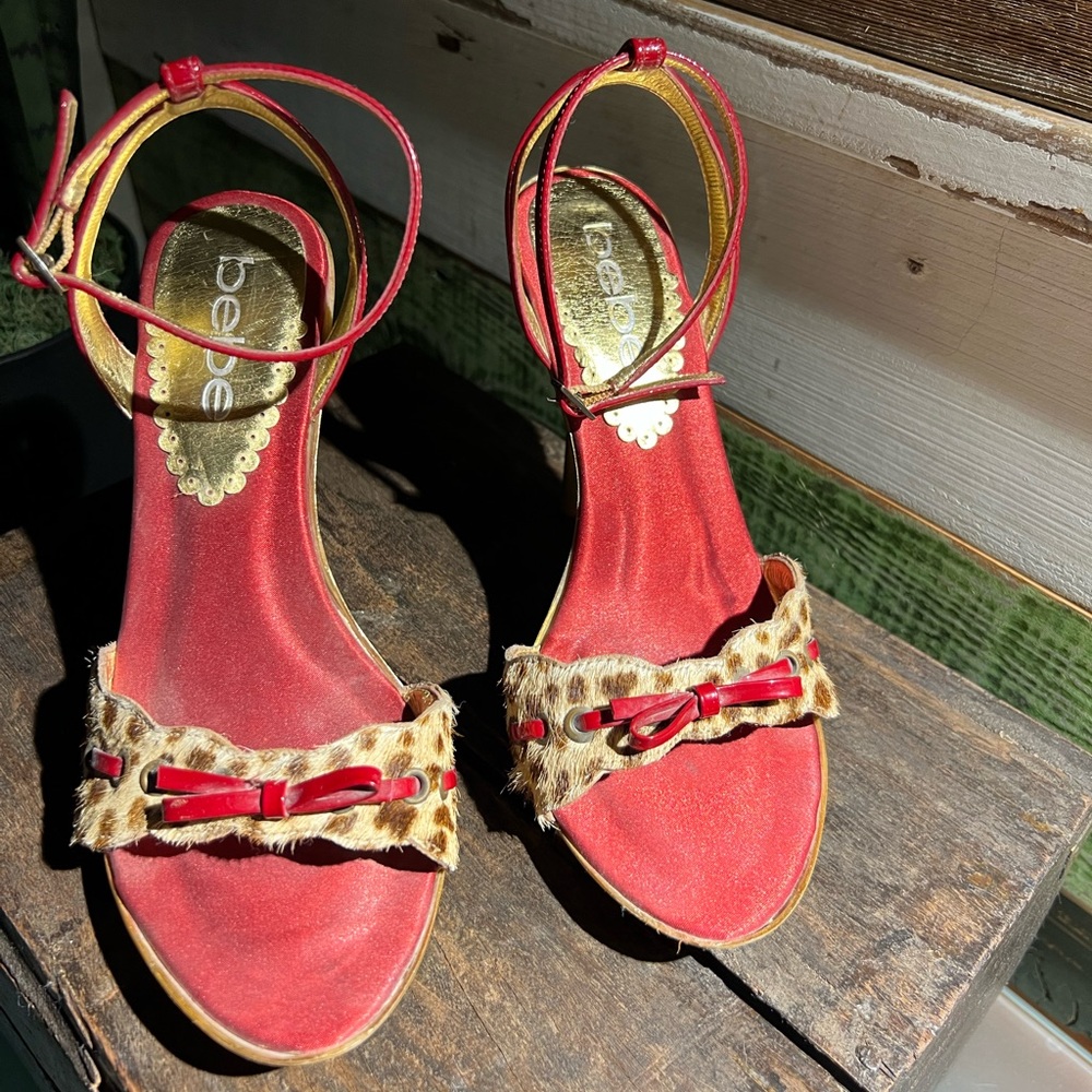 Bebe heel. Red and gold with faux leopard fur and bow. Size 6.
